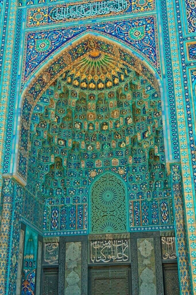 May 2011 
Entrance half dome of St. Petersburg mosque, Russia
Main entrance of the St. Petersburg mosque which was built 1910-1921 by architect Nikolai Vasilyev resembling the the Gur-e Amir mosque in Samarkand, where the tomb of Tamerlane Sultan is located.
Skylight azure blue ceramic tiles decorate the arch vault of the entrance half dome in perfect stalactites form (called muqarnas in islamic architecture). 
The mosque is located opposite the Peter and Paul Fortress in the city center. It can accomodate 8.000 worshippers and is one of the northernmost mosques in the world. The dome is a near-replica of Gur-e Amir and the rest is actually Northern Art Nouveau popular in St. Petersburg and Finland.