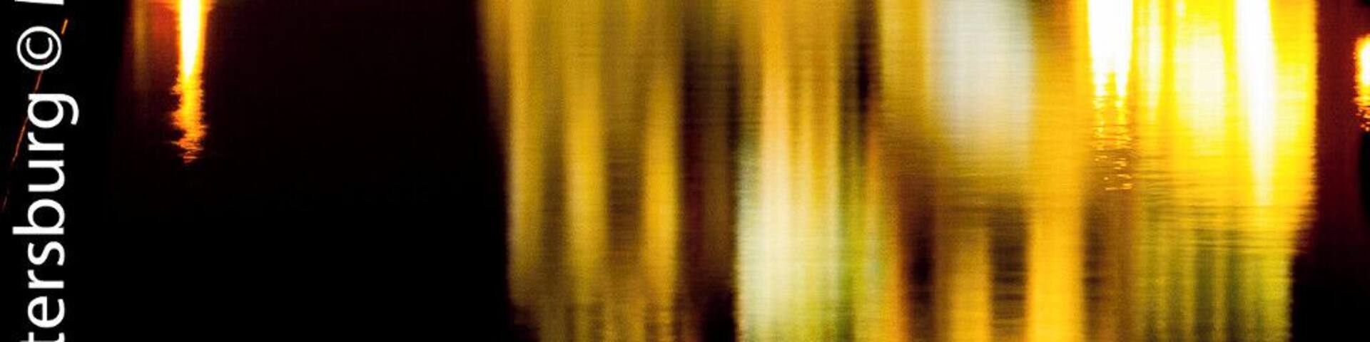 A night view of the church, mirrored on the canal.