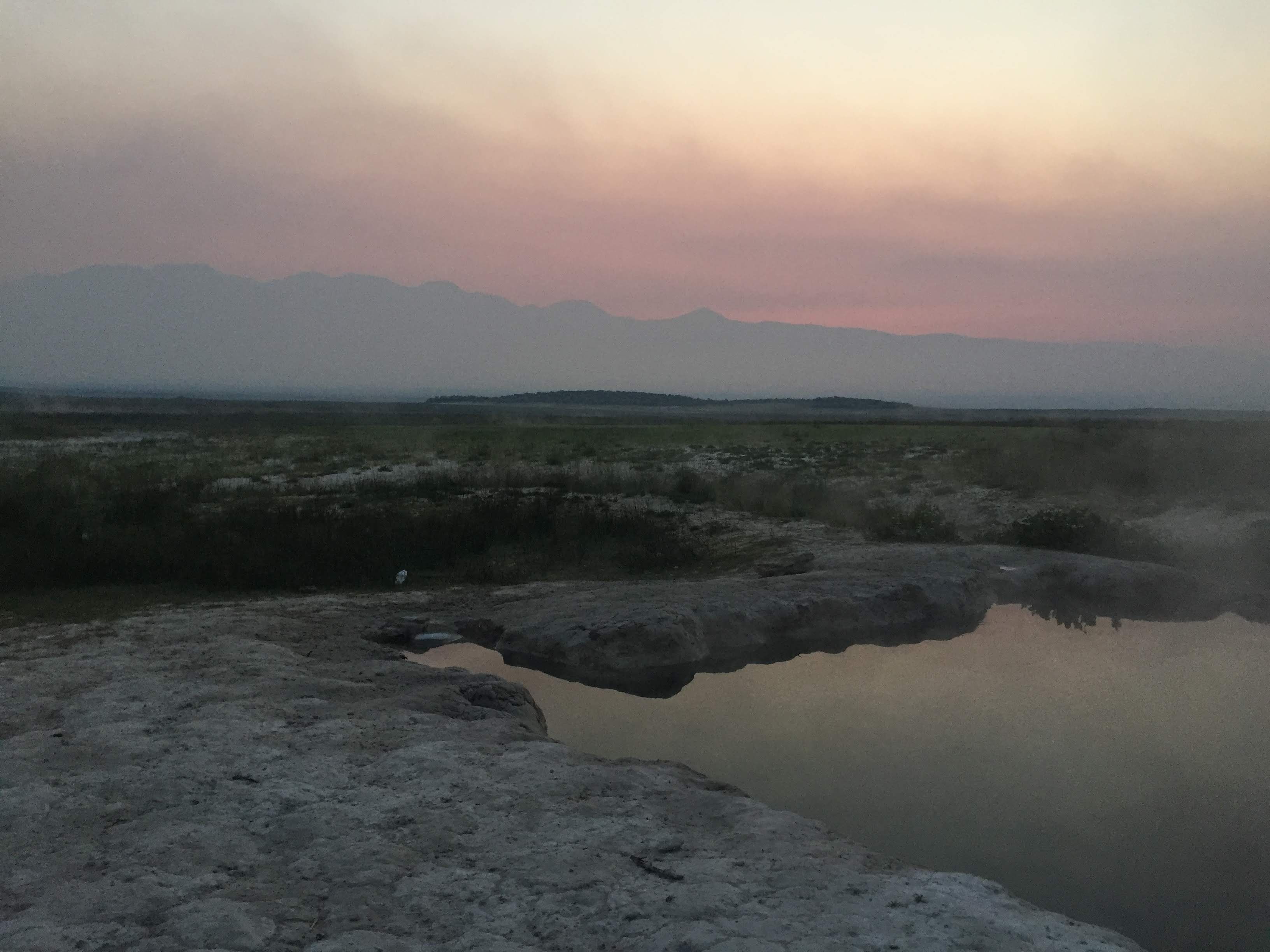 The steam of the hot springs mixed with the clouds before sunrise #Adventure