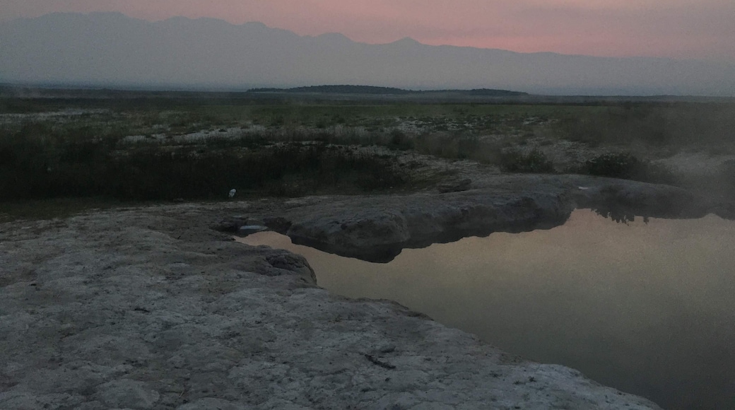 The steam of the hot springs mixed with the clouds before sunrise #Adventure
