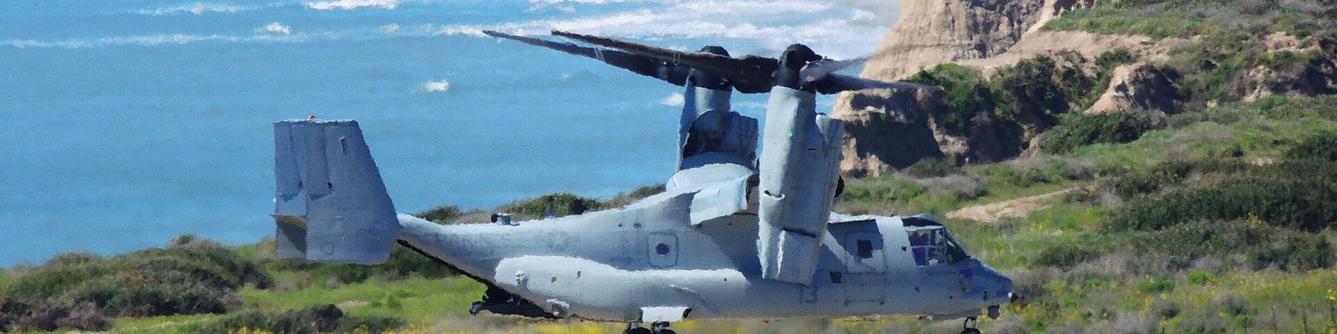 (March 2019) Driving on I-5, spotted this USMC Osprey helicopter on the helipad, propellers turning. I pulled-off at a scenic turnout nearby. No sooner had I pointed my camera the helicopter began to lift-off! In the background is the Pacific Ocean shoreline.... and the closed (2013) San Onofre Nuclear power plant.