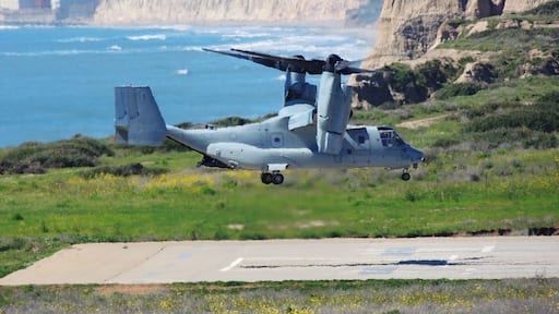 (March 2019) Driving on I-5, spotted this USMC Osprey helicopter on the helipad, propellers turning. I pulled-off at a scenic turnout nearby. No sooner had I pointed my camera the helicopter began to lift-off! In the background is the Pacific Ocean shoreline.... and the closed (2013) San Onofre Nuclear power plant.