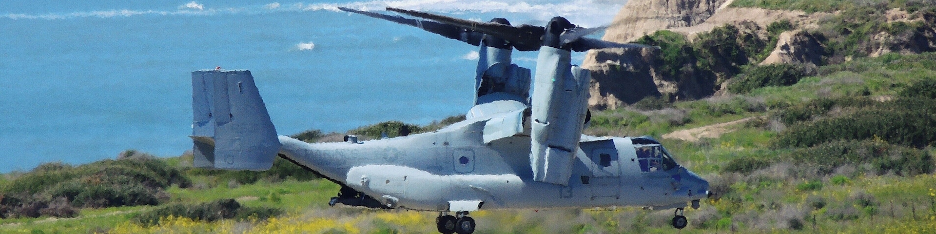 (March 2019) Driving on I-5, spotted this USMC Osprey helicopter on the helipad, propellers turning. I pulled-off at a scenic turnout nearby. No sooner had I pointed my camera the helicopter began to lift-off! In the background is the Pacific Ocean shoreline.... and the closed (2013) San Onofre Nuclear power plant.