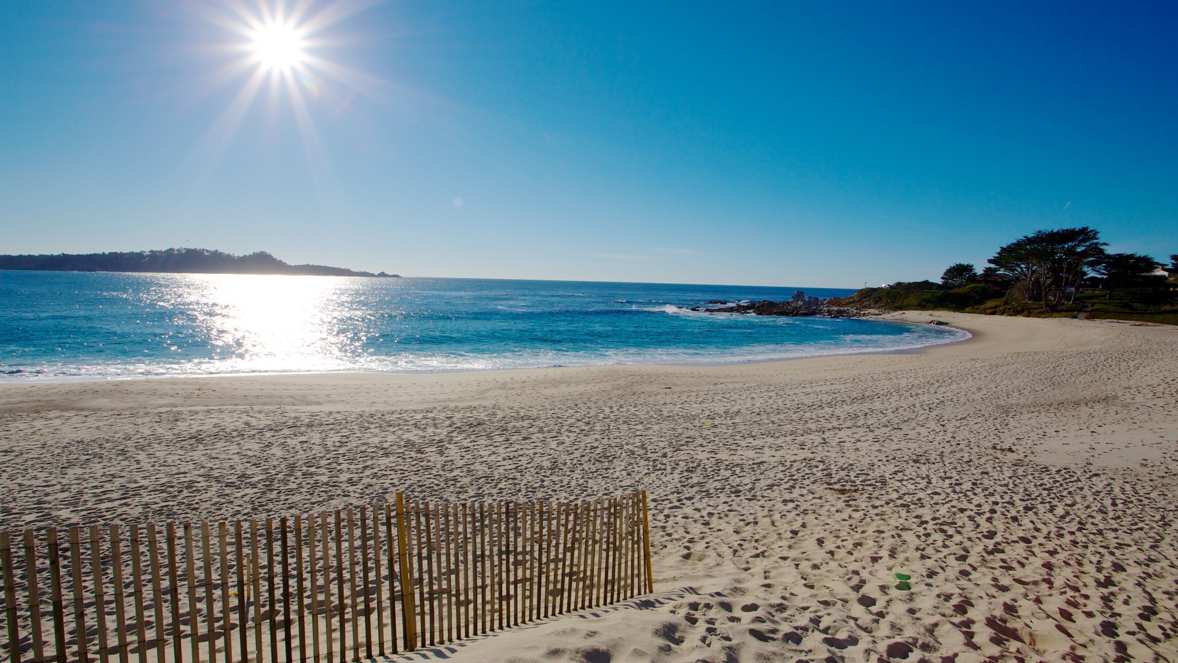 California which includes a sunset, a coastal town and a beach