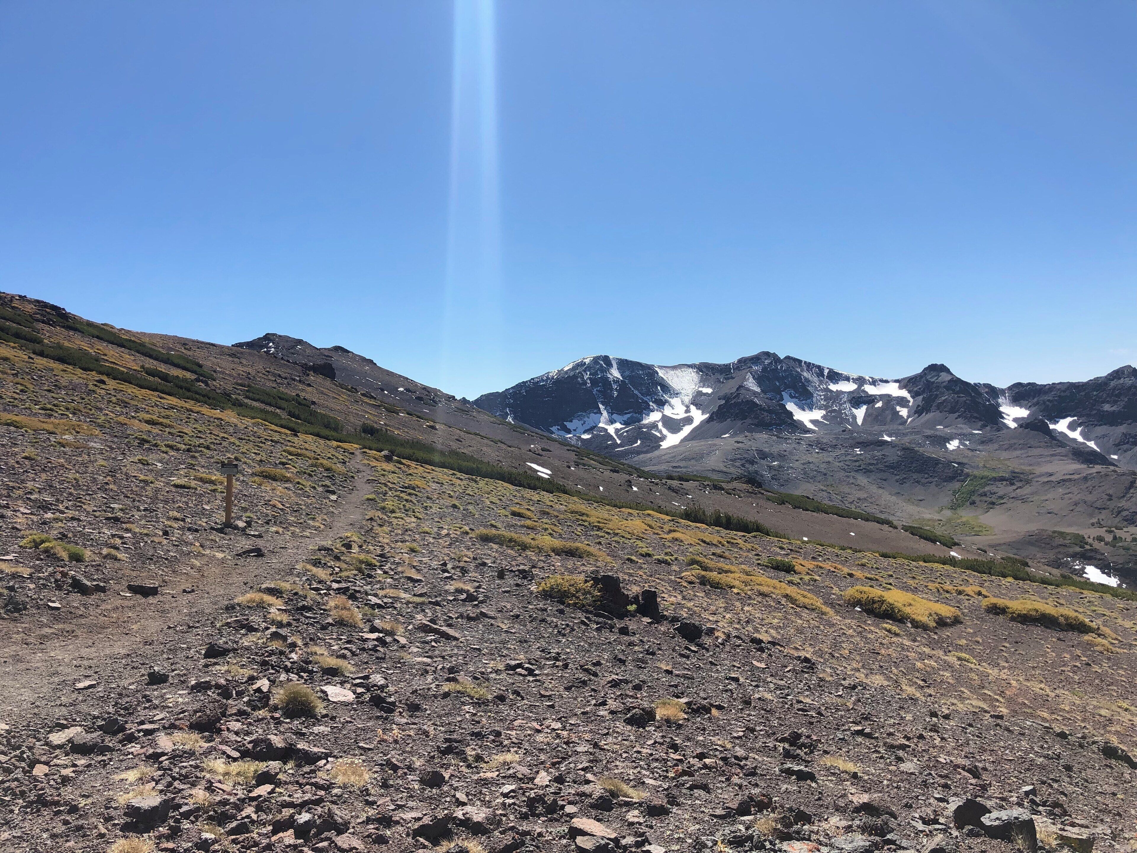 Climb to the top where Emigrant  Wilderness meets Stanislaus National Forest on the Pacific Crest Trail. Lots of snow for September. Beautiful views all around. #Adventure