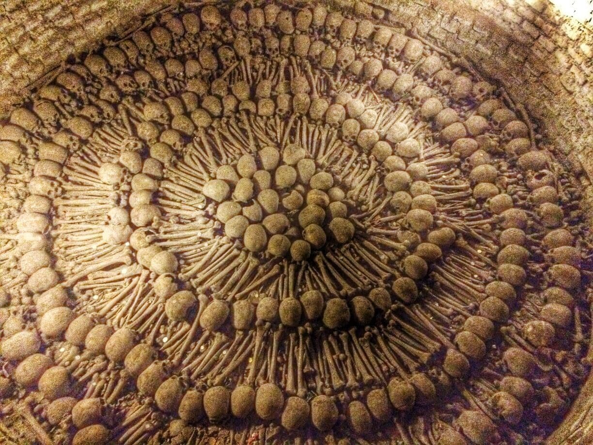 This ossuary in the catacombs of the Monastery of Saint Francis (Convento de San Francisco) is estimated to be 10 meters deep full of bones. The catacombs were in use during the 17th to 19th centuries and contain around 70,000 remains of the people of Lima, Peru. The Monastery and Cathedral are part of the Historic Center of Lima which is a UNESCO World Heritage site.  
