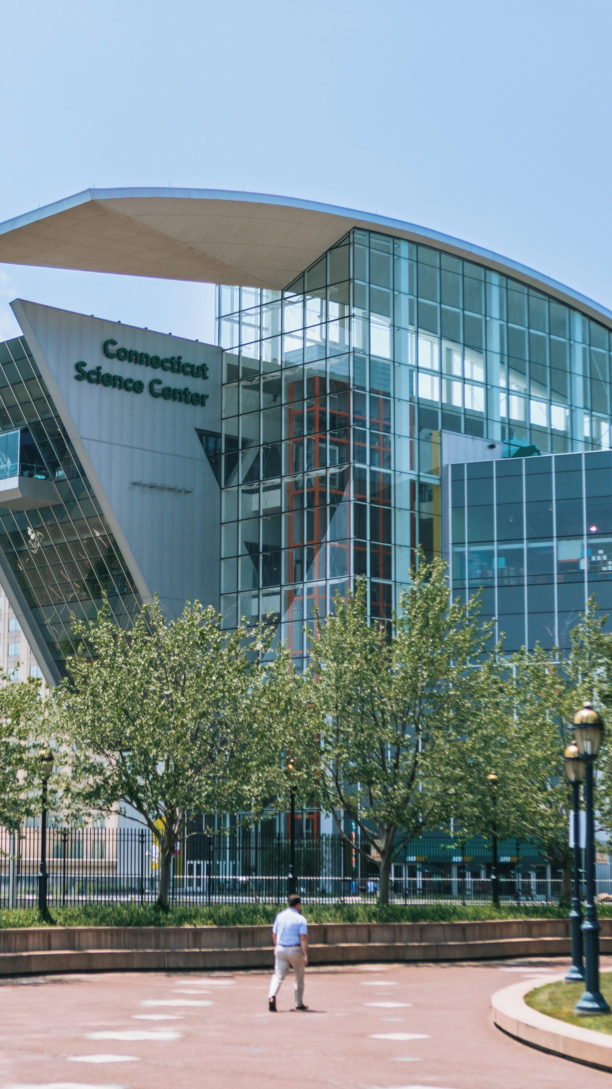 Bushnell Park showcases the vibrant Connecticut Science Center in Downtown Hartford on a sunny day