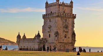 I took this in March at Belém Tower, in Lisbon, Portugal. And came at just the right time - sunset time! And yet there were still quite a few people lazying about :). It was a beautiful Spring day there!
This fortified tower is a UNESCO World Heritage Site and one of the most iconic sites in Lisbon! Built in the early 16th-century, it played a significant role in the Age of Discoveries. The tower was commissioned by King John II to be part of a defense system at the mouth of the Tagus river and a ceremonial gateway to Lisbon. The structure was built from Lioz limestone and is composed of a bastion and a 30 m