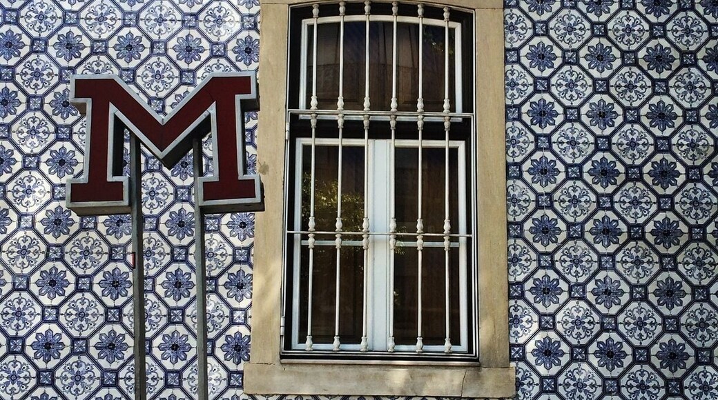 Subway entry in Lisbon in front of one ot the many tiled-covered buildings.