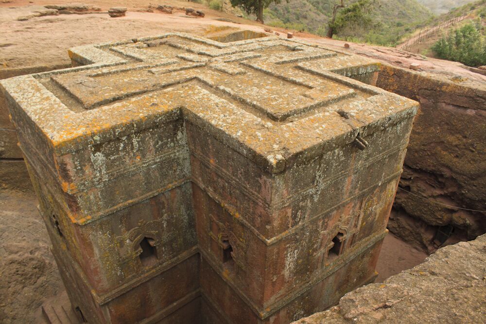 The Church of St. George is one of eleven monolithic churches in Lalibela.

Carved from solid red volcanic rock in the 12th century, it is the most well known and last built of the eleven churches in the Lalibela area, and has been referred to as the “Eighth Wonder of the World”. 

Lalibela, King of Ethiopia, sought to recreate Jerusalem, and structured the churches landscape and religious sites in such a way as to achieve such a feat. The churches at Lalibela are clustered in two major groups, one representing the earthly Jerusalem, and the other representing the heavenly Jerusalem. Located directly between them is a trench representing the River Jordan.

#History
