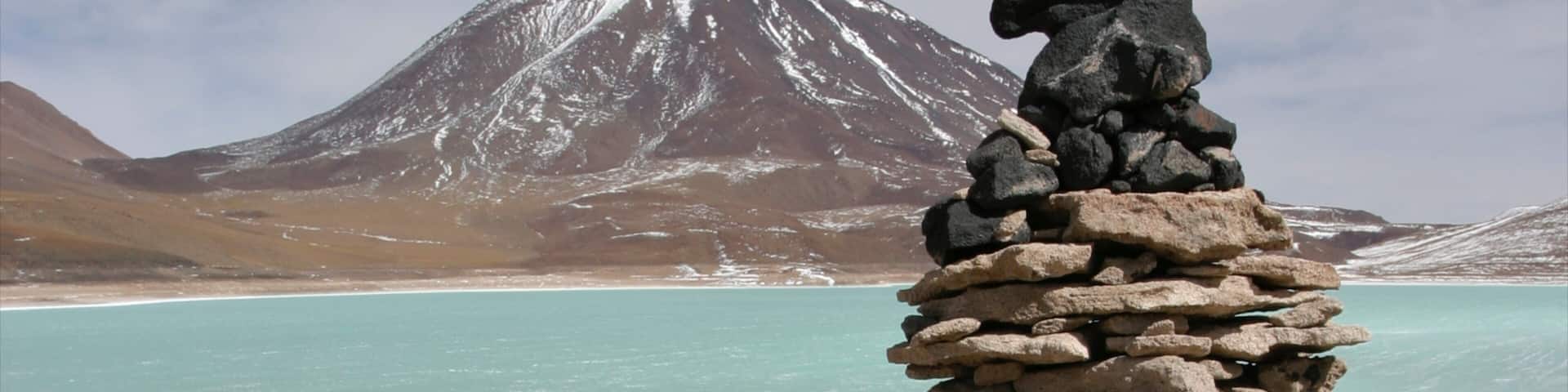 Bolivia featuring snow, a lake or waterhole and mountains