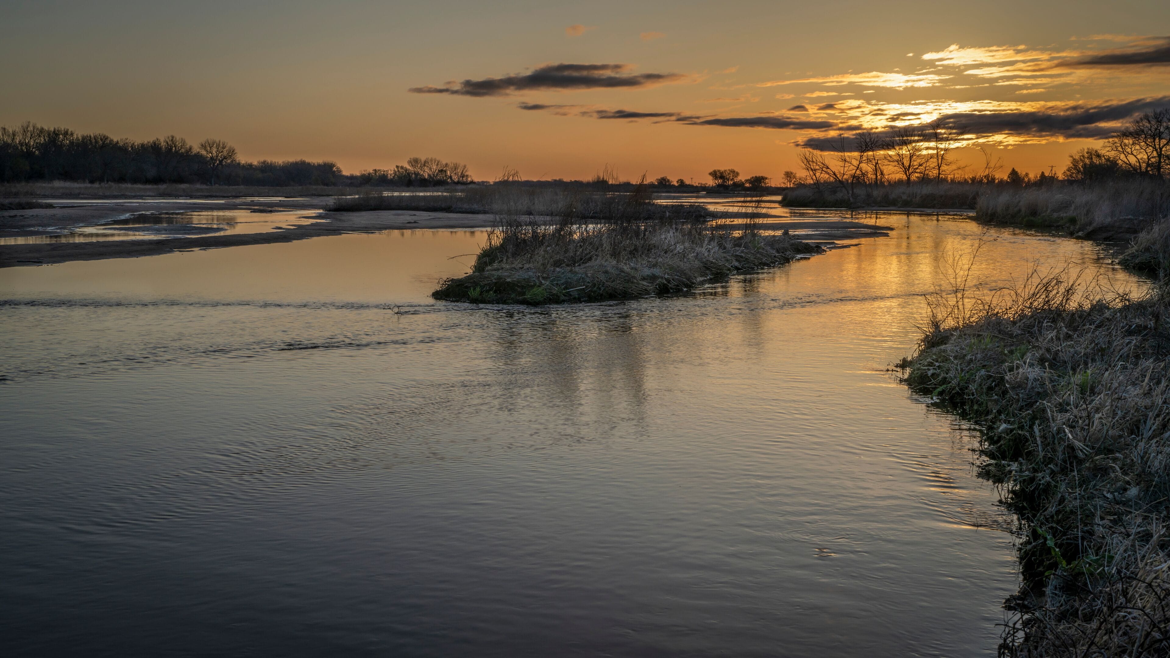 springtime sunrise over wide and shallow Platte River near Kearney, Nebraska