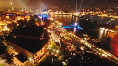 Linz showing boating, a river or creek and night scenes