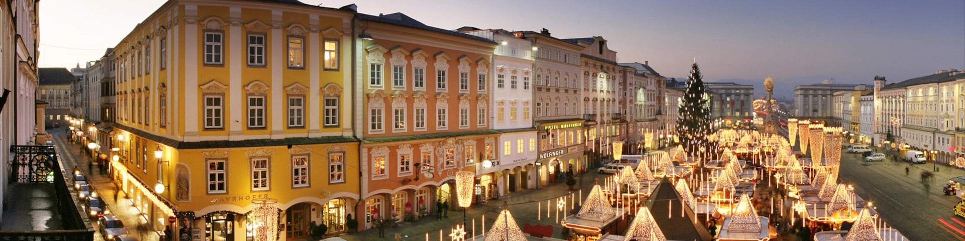 Linz which includes a sunset, a city and a square or plaza