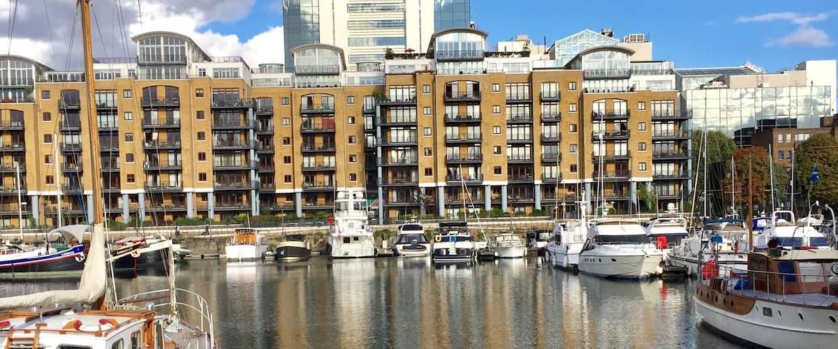 St Katharine Docks, in the London Borough of Tower Hamlets, were one of the commercial docks serving London, on the north side of the river Thames just east (downstream) of the Tower of London and Tower Bridge. They were part of the Port of London, in the area now known as the Docklands, and are now a popular housing and leisure complex.
