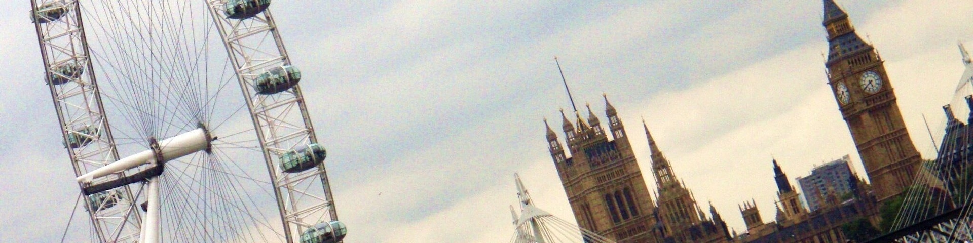 From the Jubilee Gardens on the south bank of the Thames, looking across the London Eye and the Westminster Bridge towards Big Ben.