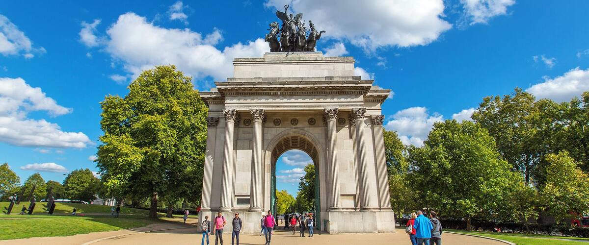 Wellington Arch is a triumphal arch at the center of Hyde Park in central London. It took four years to build and was completed in 1830, though not at the site where it currently stands and not with the statue which currently resides atop. The arch was moved to Hyde Park around 1882-1883 and the original adorning statue was of the 1st Duke of Wellington riding a horse, which gave the arch its name.