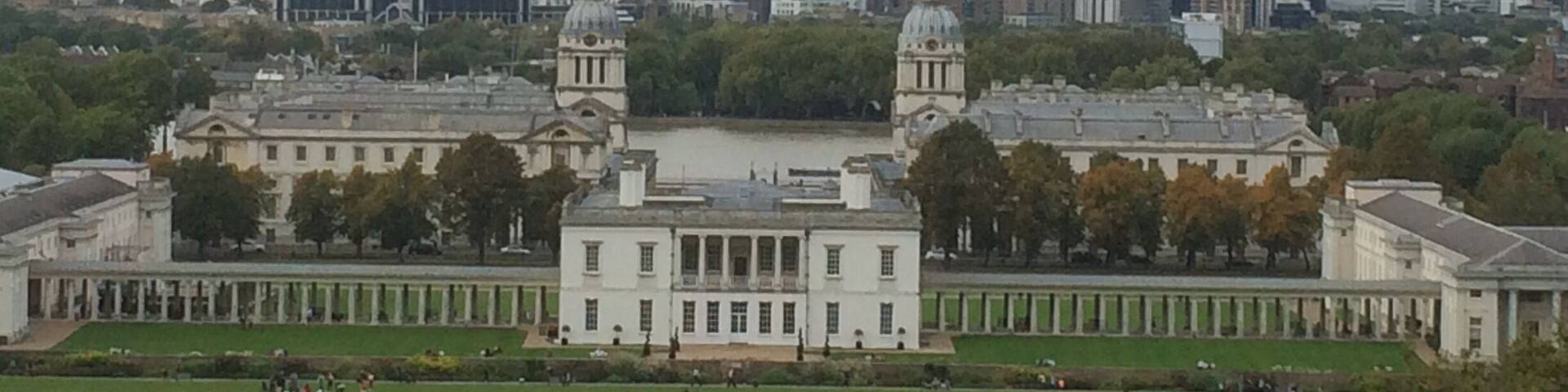 The view across to Canary Wharf from the Royal Observatory at Greenwich. Old Royal Naval college in the foreground.
