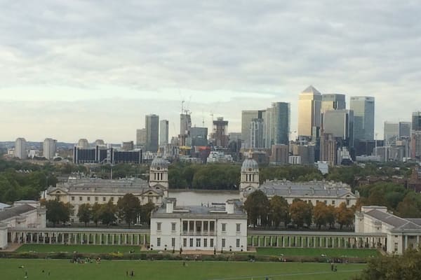 The view across to Canary Wharf from the Royal Observatory at Greenwich. Old Royal Naval college in the foreground.