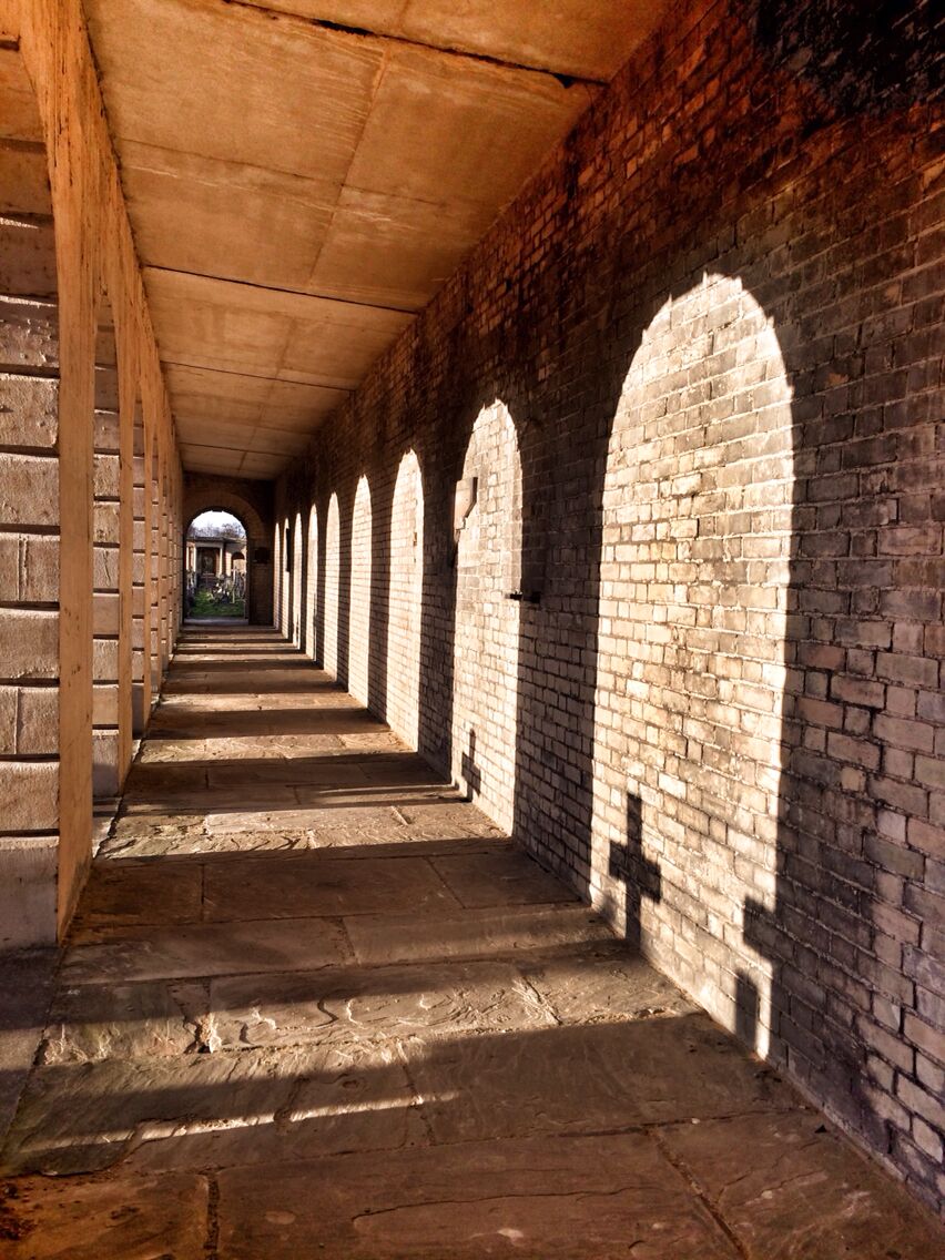 The arches reflected on the wall above the catacombs