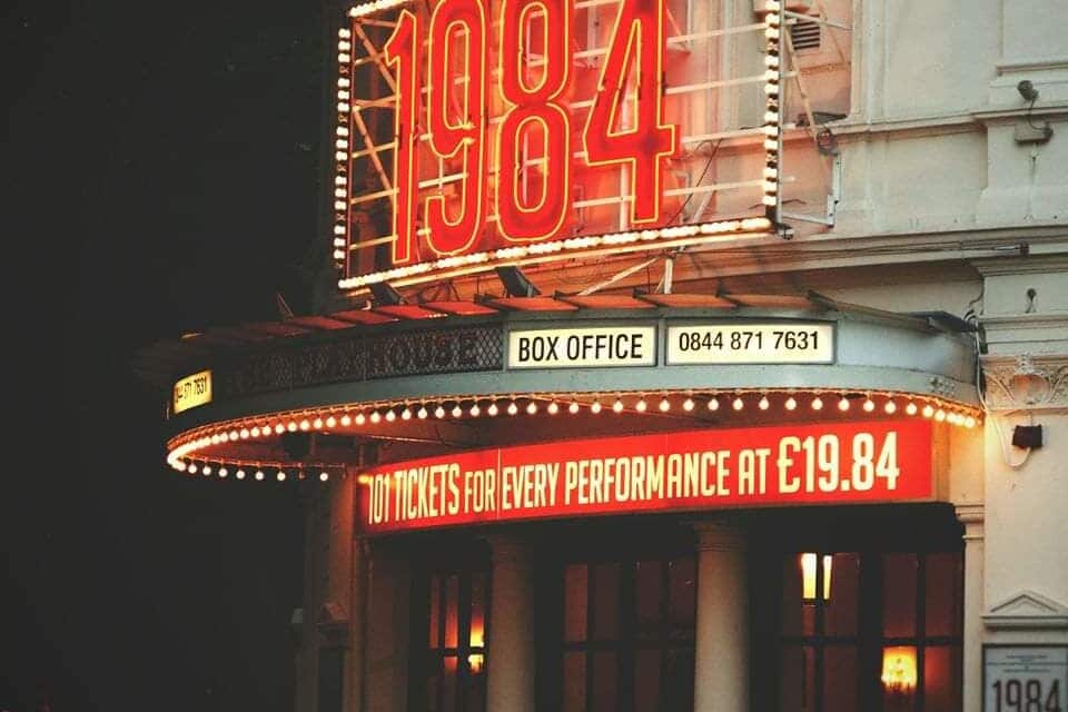 The Playhouse 1984 marquee with a box office and ticket price sign.
