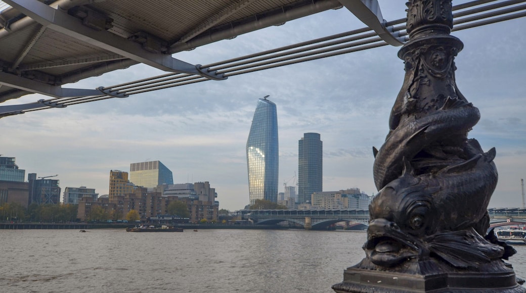 View looking west under the Millennium footbridge of the ever developing London skyline.