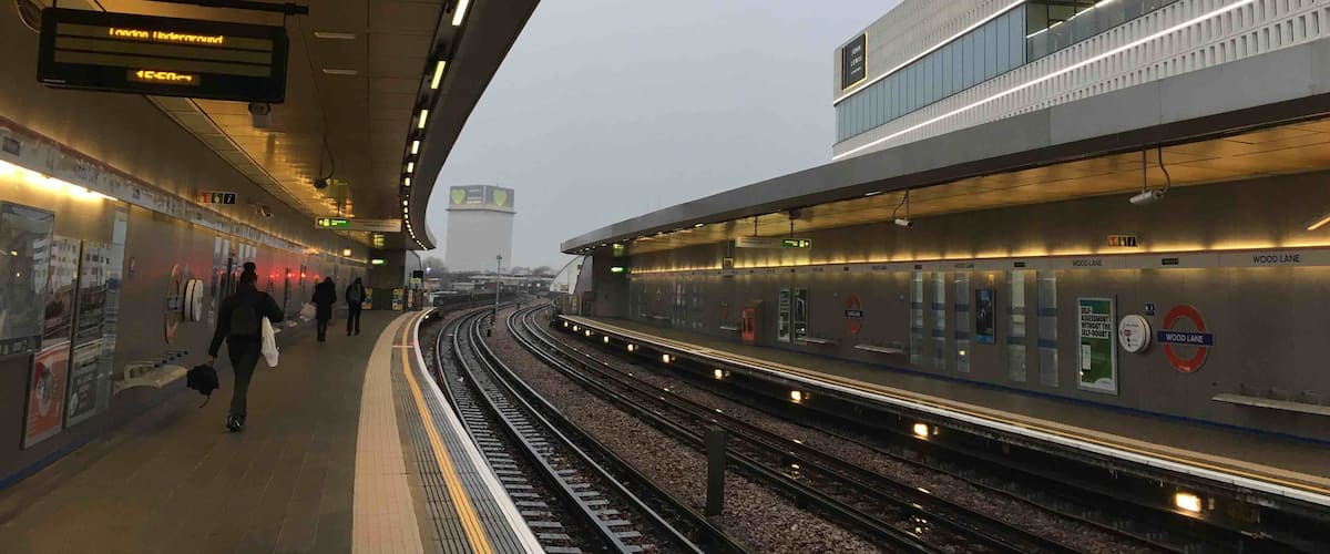 Wood Lane tube station with Grenfell Tower in the distance