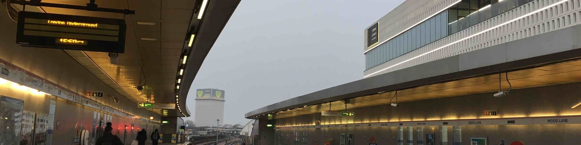 Wood Lane tube station with Grenfell Tower in the distance