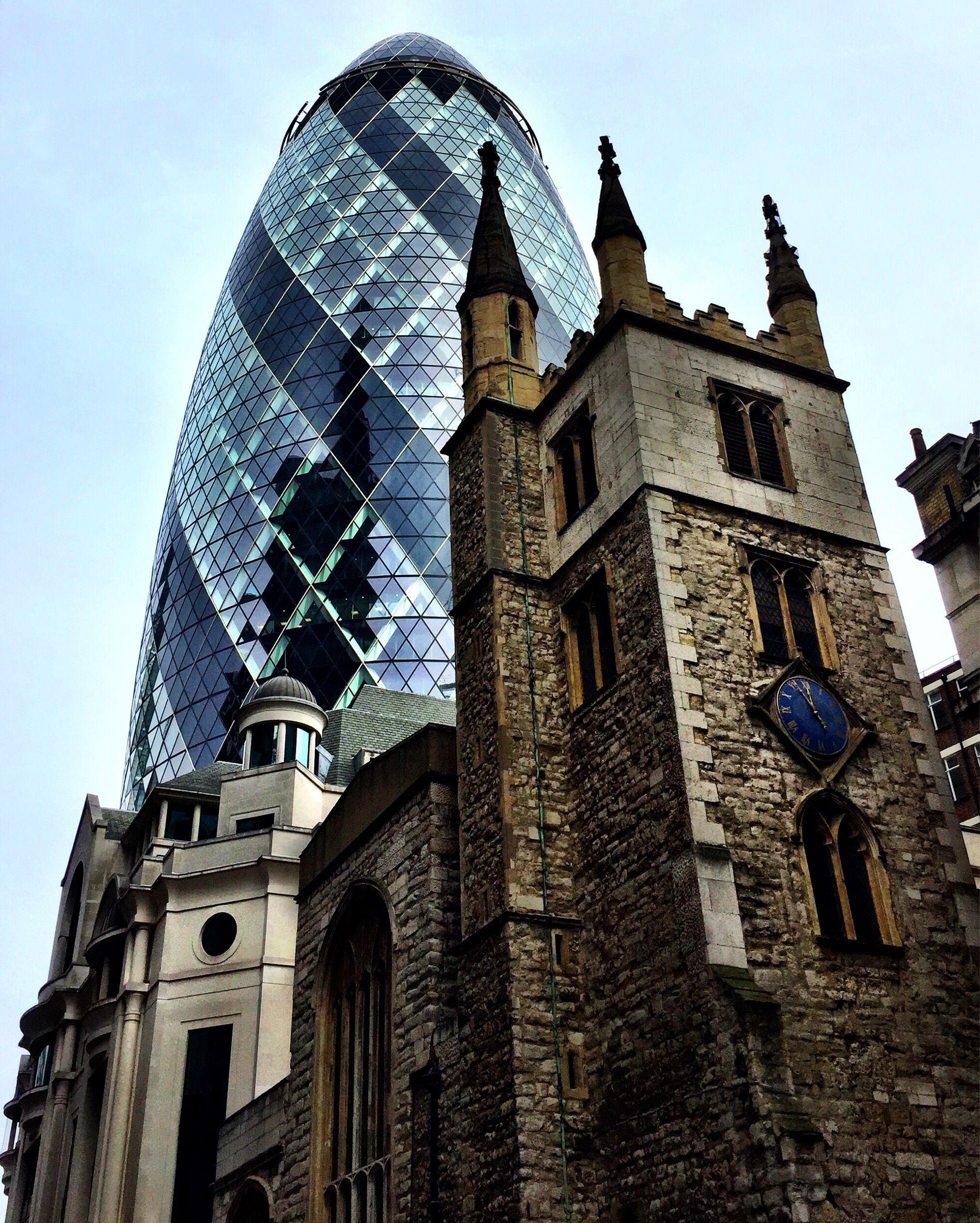 30 St Mary Axe, popularly known as "The Gherkin", with the church of St Andrew Undershaft in the foreground - two of the faces of London (a walk down Leadenhall Street really brings this home, with churches and the famous Leadenhall Market squeezed between modern structures). Taken March 2017. 