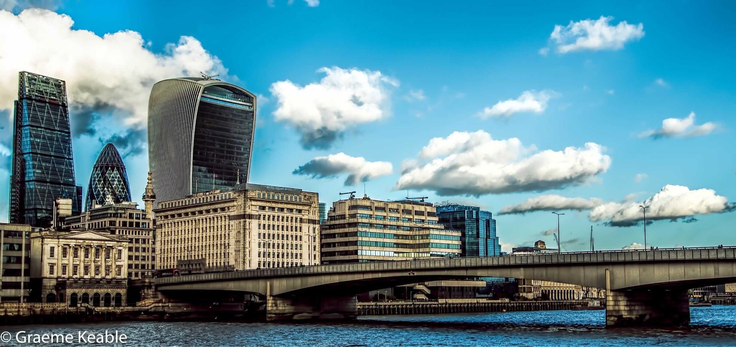 The view across London Bridge showing the walkie talkie (voted the ugliest building in the UK) the gherkin and the razor.