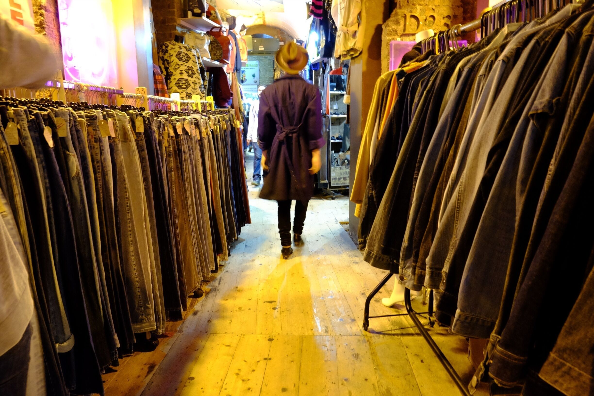 The colours and shapes in the covered stalls of Camden Market are full of possibilities. As I was walking passed, I noticed the two racks of clothes perfectly framing the returning stallkeeper, and I just fired from the hip!