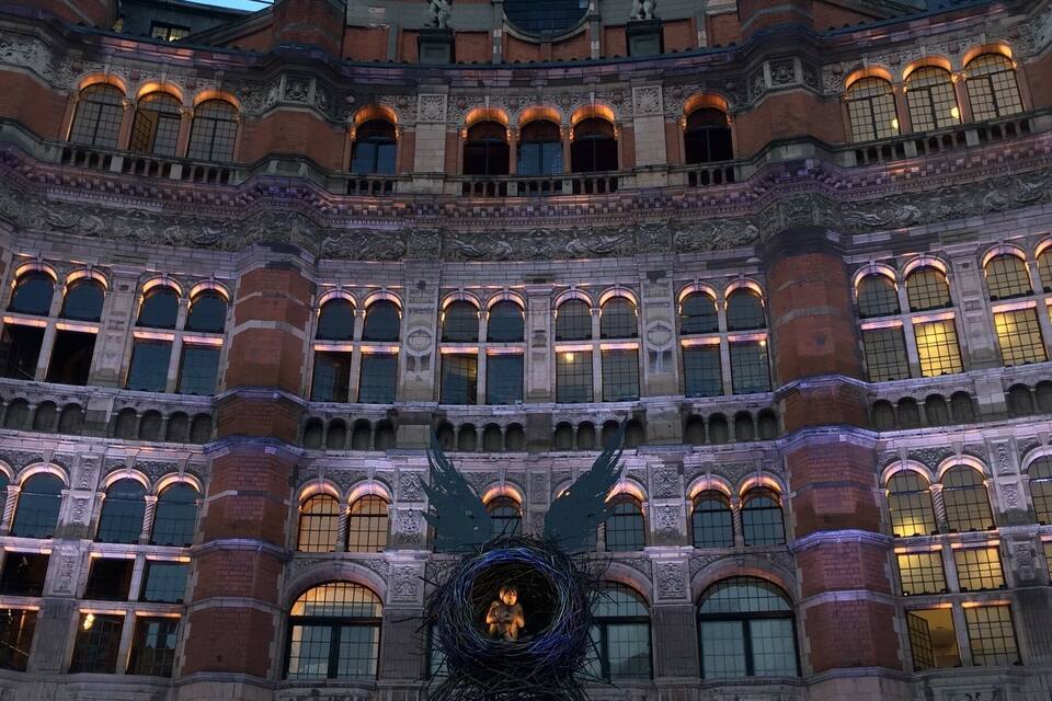 A building with ornate architecture and a sign reading "Harry Potter and the Cursed Child".