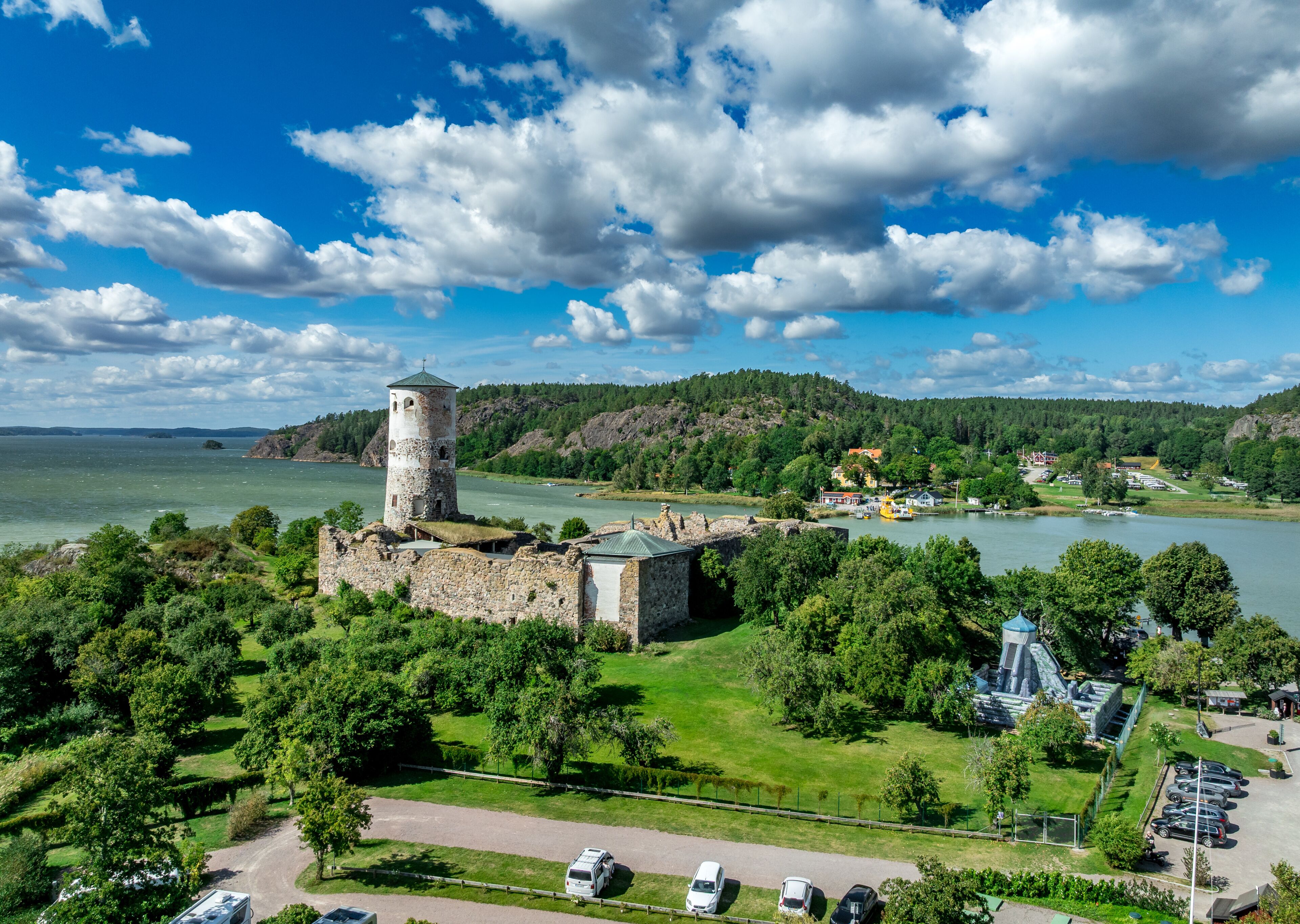 Aerial perspective of Stegeborg Castle, a Swedish ruin nestled in a bay