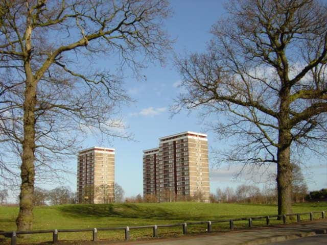 Tower Blocks from Old Rough Lane, Kirkby. This wooded area was once known as Old Rough. The tower blocks, Quarry Green Heights and many of the local roads take their name from the quarry which was nearby.