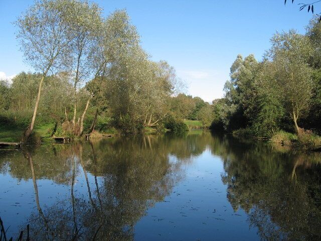 Carr Lane Pond, Prescot Popular with local fishermen and fed by Prescot Brook, the photo was taken from the southerly end of this small pond off Carr Lane, Prescot on a still autumn day.