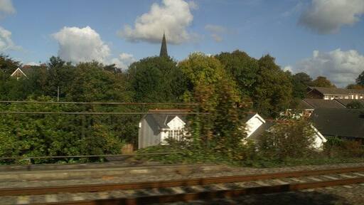 Huyton Junction, and beyond, as seen from the 12.01 from Newton-le-Willows. Just east of Huyton Station the line from Wigan and St Helens joins the Liverpool - Manchester line.