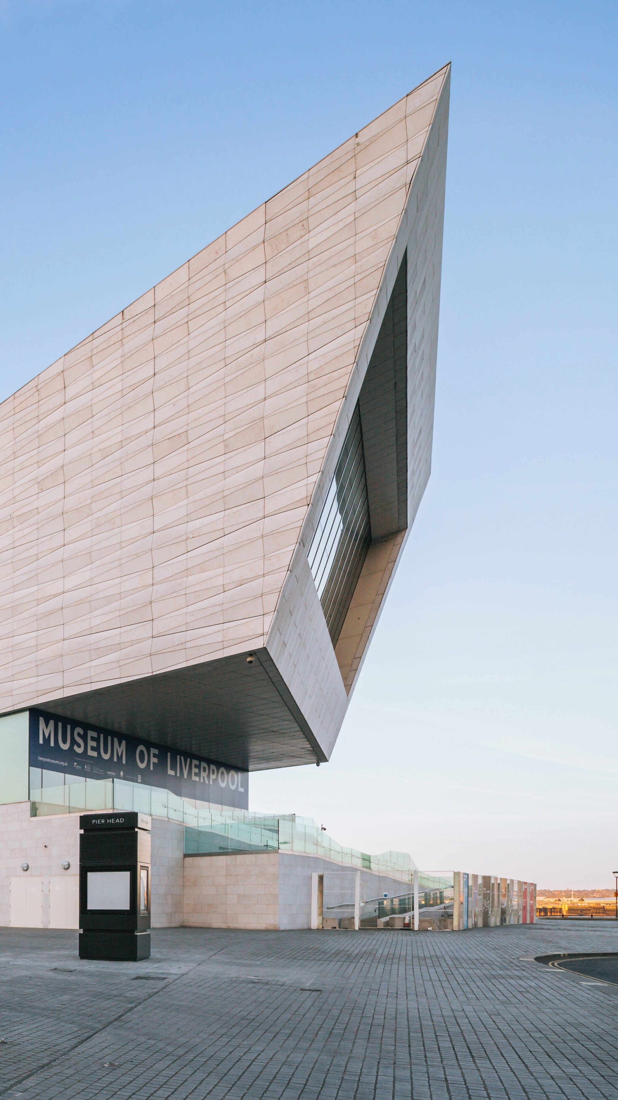 Museum of Liverpool showcases modern architecture in Liverpool City Centre, England under a clear blue sky
