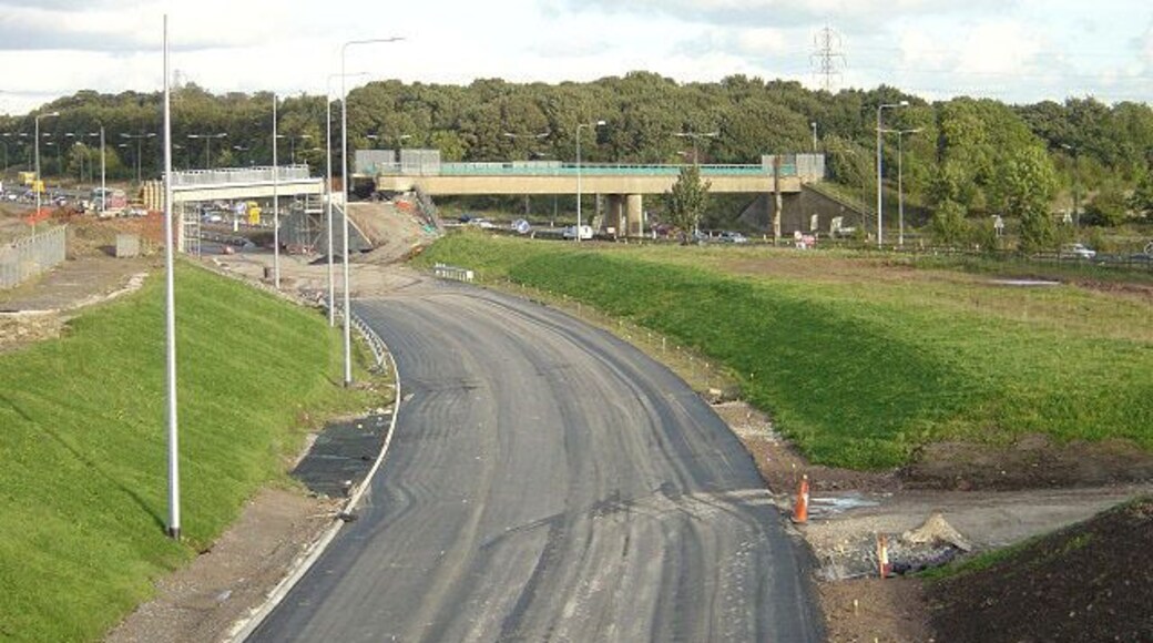 New slip road, Tarbock Island This is the new connecting slip road being constructed from the M57 to the eastbound M62. The bridge over the existing motorway carried the colliery branch railway from Cronton Colliery to the Liverpool and Manchester main line at Huyton Quarry.