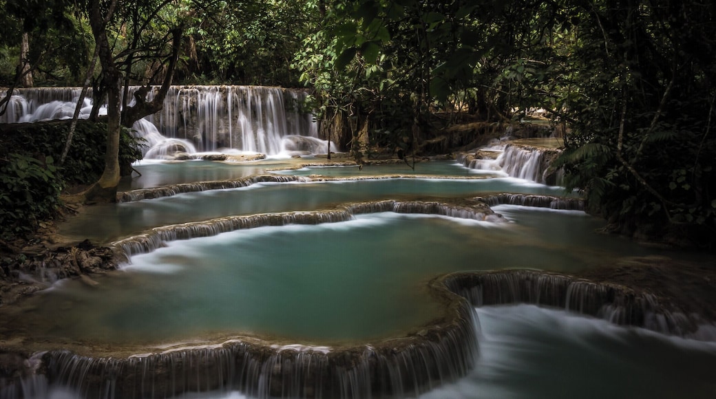 There is a whole series of these cascading waterfalls at Kueng Si waterfalls, near Luang Prabang in Laos. Worth a visit, go early if you want photos without people swimming in it.