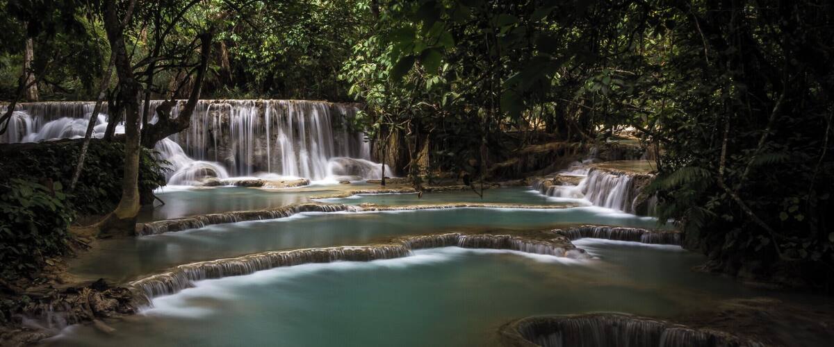 There is a whole series of these cascading waterfalls at Kueng Si waterfalls, near Luang Prabang in Laos. Worth a visit, go early if you want photos without people swimming in it.