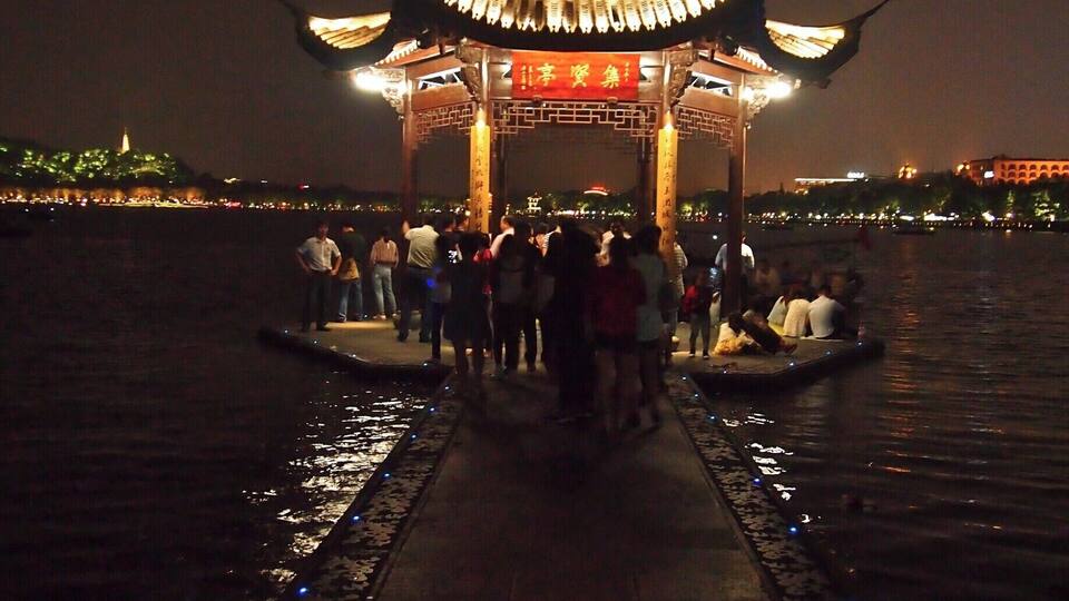 Strolling around the West Lake at night. Hangzhou's West Lake is considered one of the most romantic places in the whole of China!