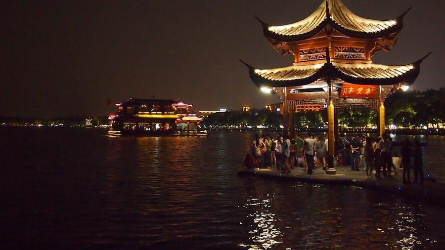 Strolling around the West Lake at night. Hangzhou's West Lake is considered one of the most romantic places in the whole of China!