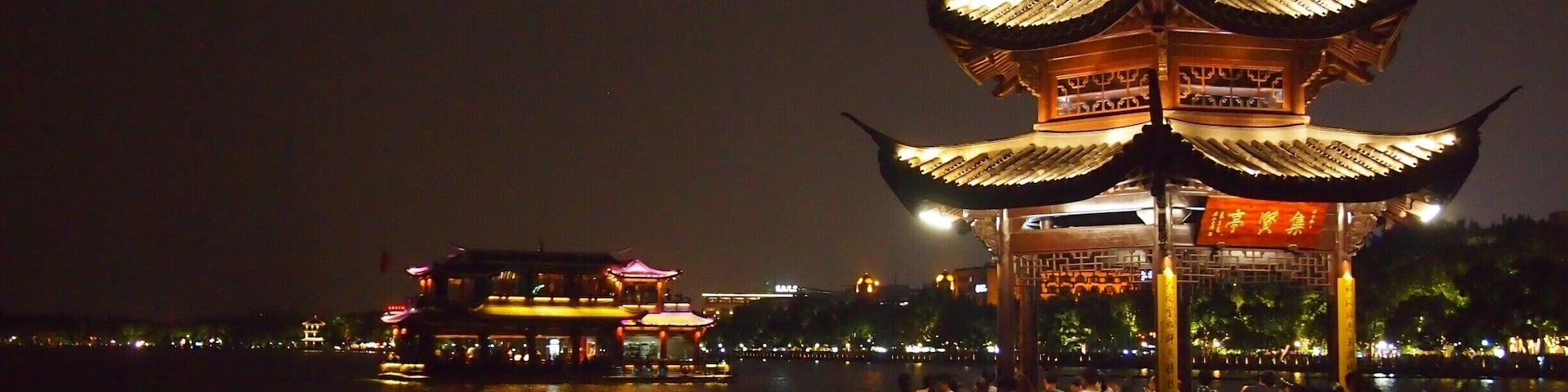 Strolling around the West Lake at night. Hangzhou's West Lake is considered one of the most romantic places in the whole of China!