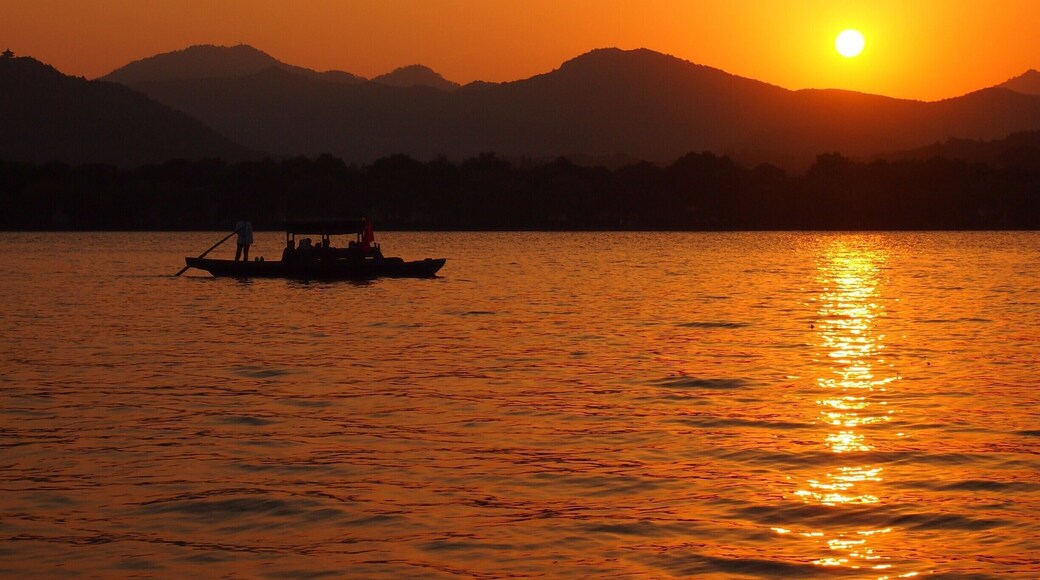 Sunset view of Hangzhou's beautiful West Lake from Xiao Ying island, also called "The three ponds mirroring the Moon".