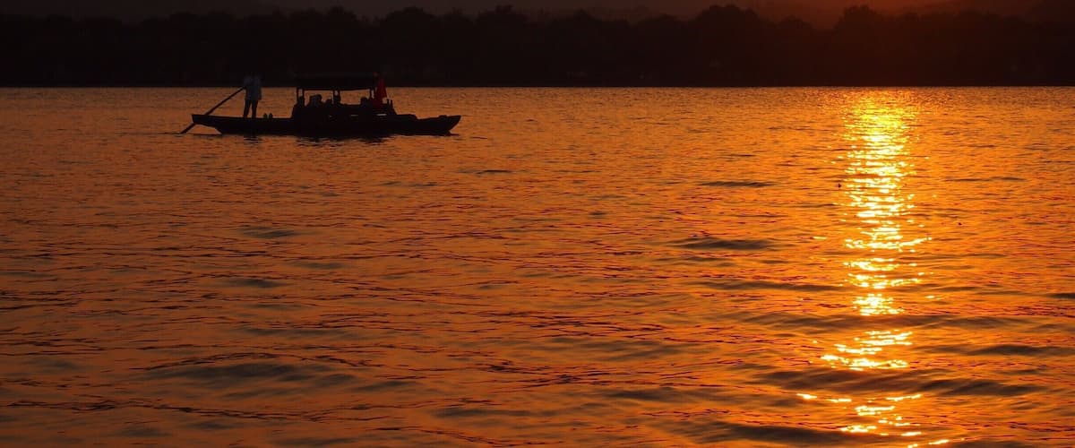 Sunset view of Hangzhou's beautiful West Lake from Xiao Ying island, also called "The three ponds mirroring the Moon".