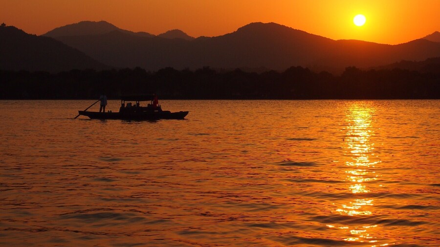 Sunset view of Hangzhou's beautiful West Lake from Xiao Ying island, also called "The three ponds mirroring the Moon".
