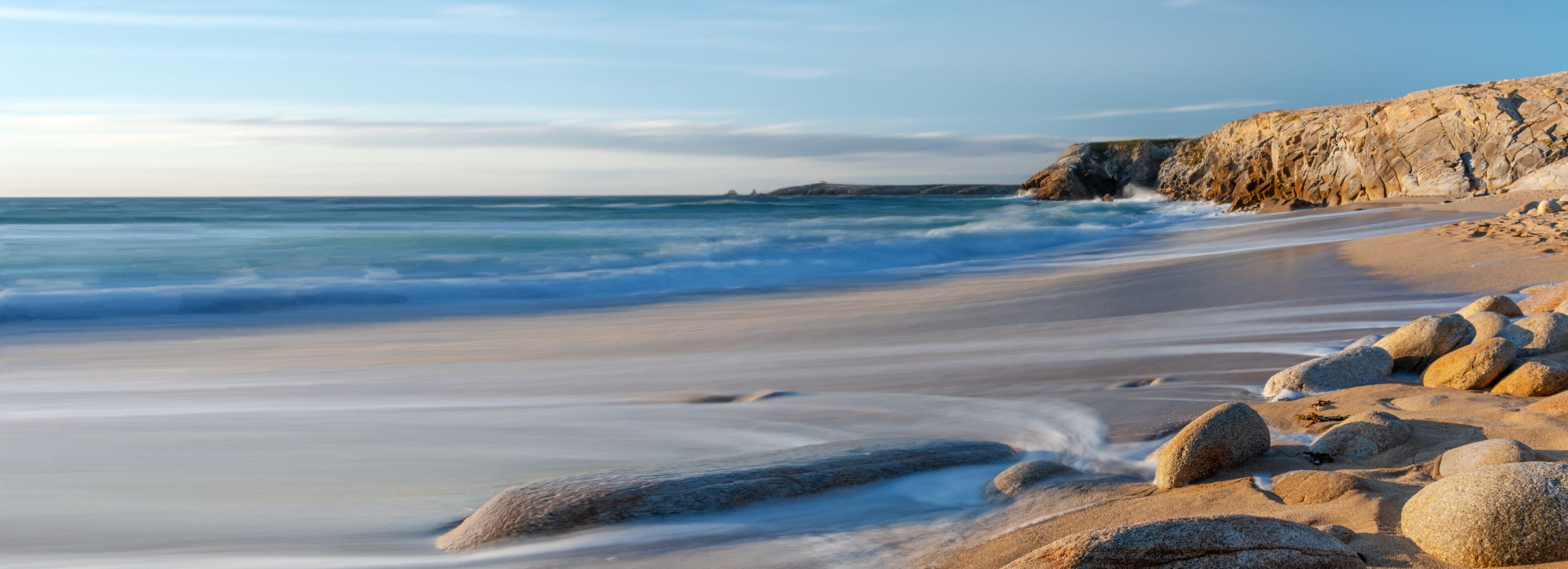 French landscape - Bretagne. A beautiful beach with wild cliffs in the background.