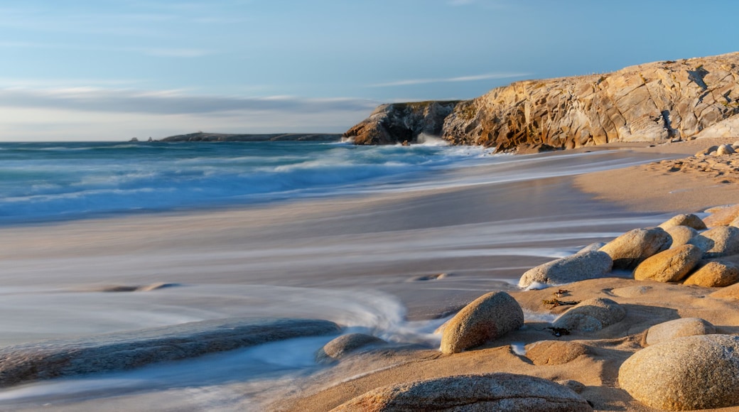 French landscape - Bretagne. A beautiful beach with wild cliffs in the background.