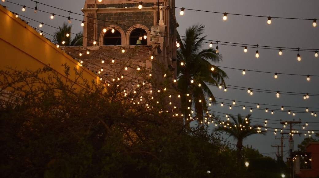 Evening illuminated Church in the city of Loreto, Mexico, Baja California Sur stock photo images. Mision de Loreto vertical photo images. Night Catholic church with a bell tower in Loreto Mexico photo
