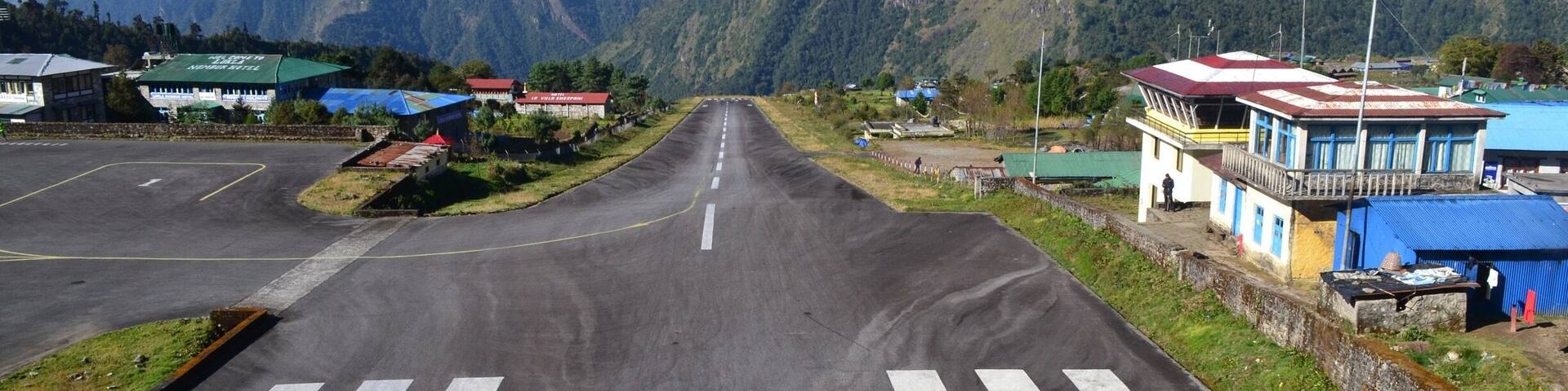 Lukla Airport one of most dangerous air strips in the world. Only 460 meters in length with a 50 meter elevation change from the bottom of the runway to the top and about a 9000 ft drop off at the end of the runway.